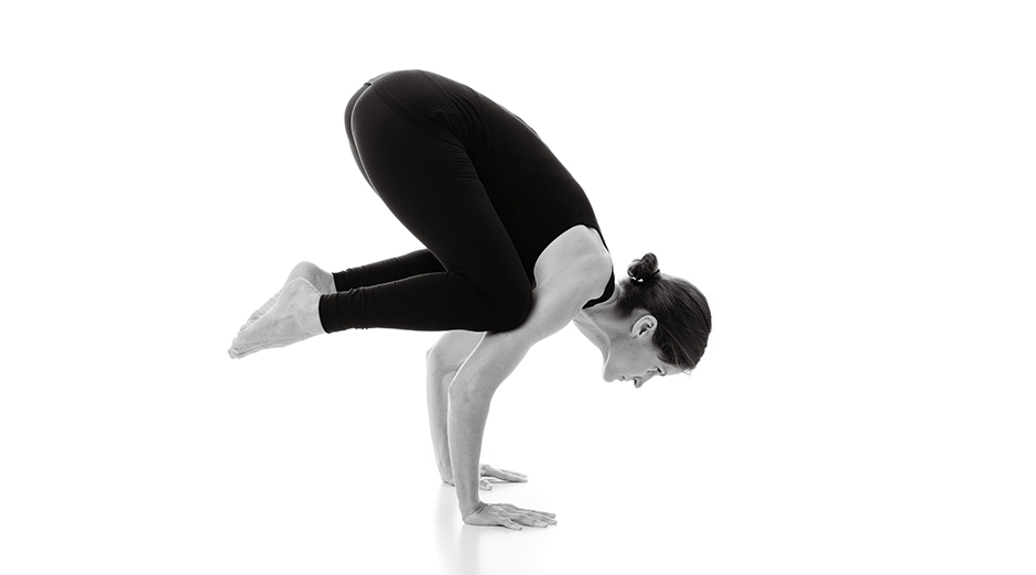 Premium Photo | Woman practicing yoga doing bakasana exercise or crane pose