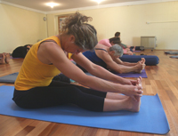 yoga-class-forward-bend.jpg yoga-class-forward-bend.jpg